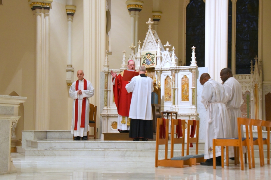 Bishop Deeley offers the opening prayer.