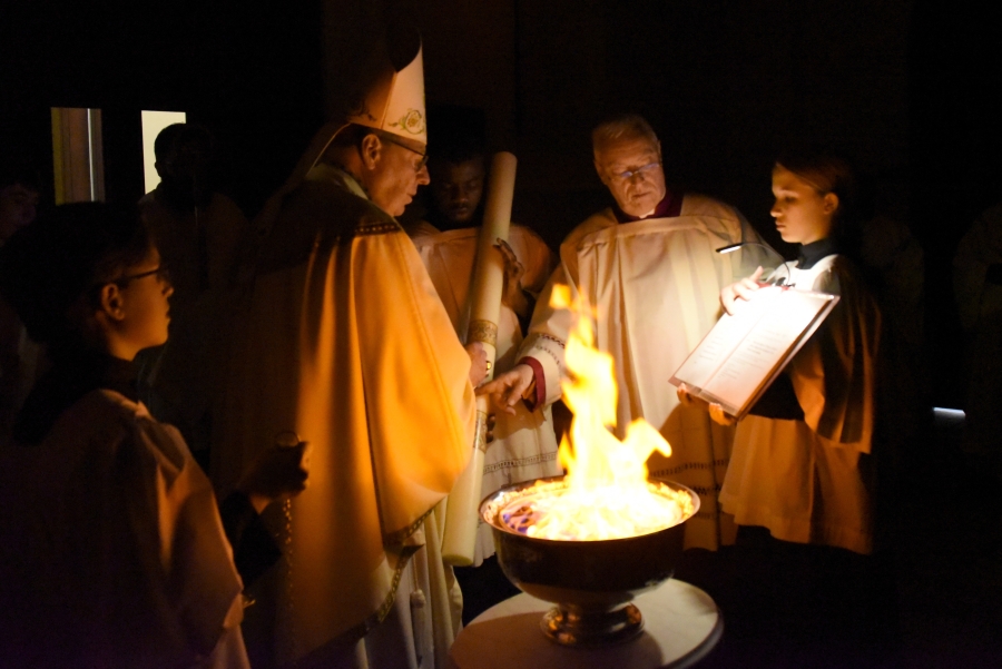 The bishop blesses the Easter fire.