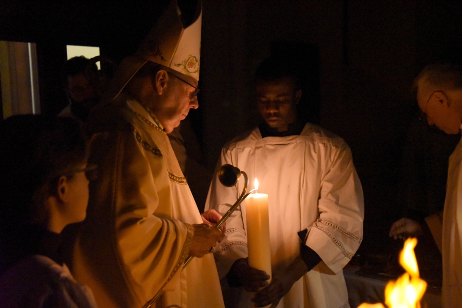 The bishop lights the Easter candle.