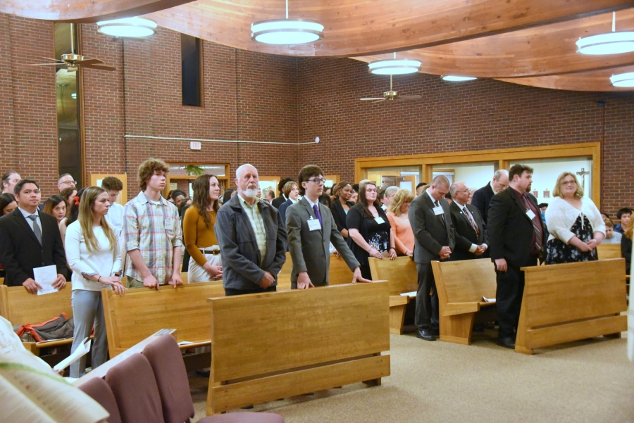 The newly confirmed standing in the pews.