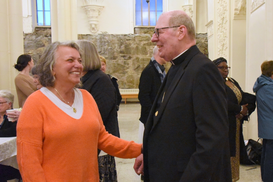 Nancy Naimey greets Bishop Deeley during the reception.