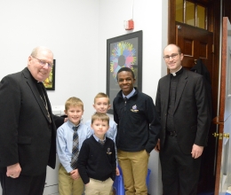 Two priests with four students