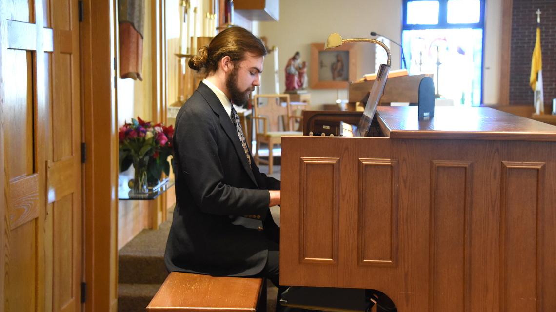 Liam Scott plays the organ at Holy Martyrs Church in Falmouth.