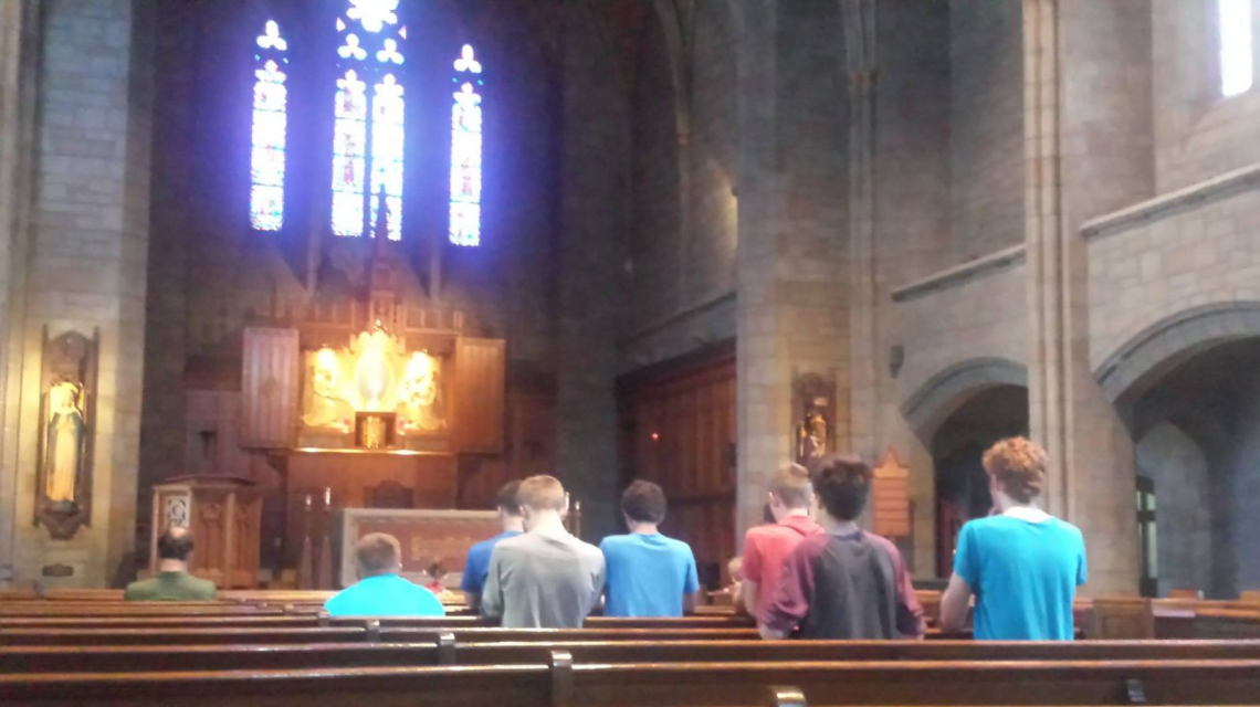 Discerners praying in pews