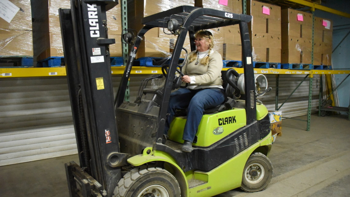 Dixie Shaw on a forklift