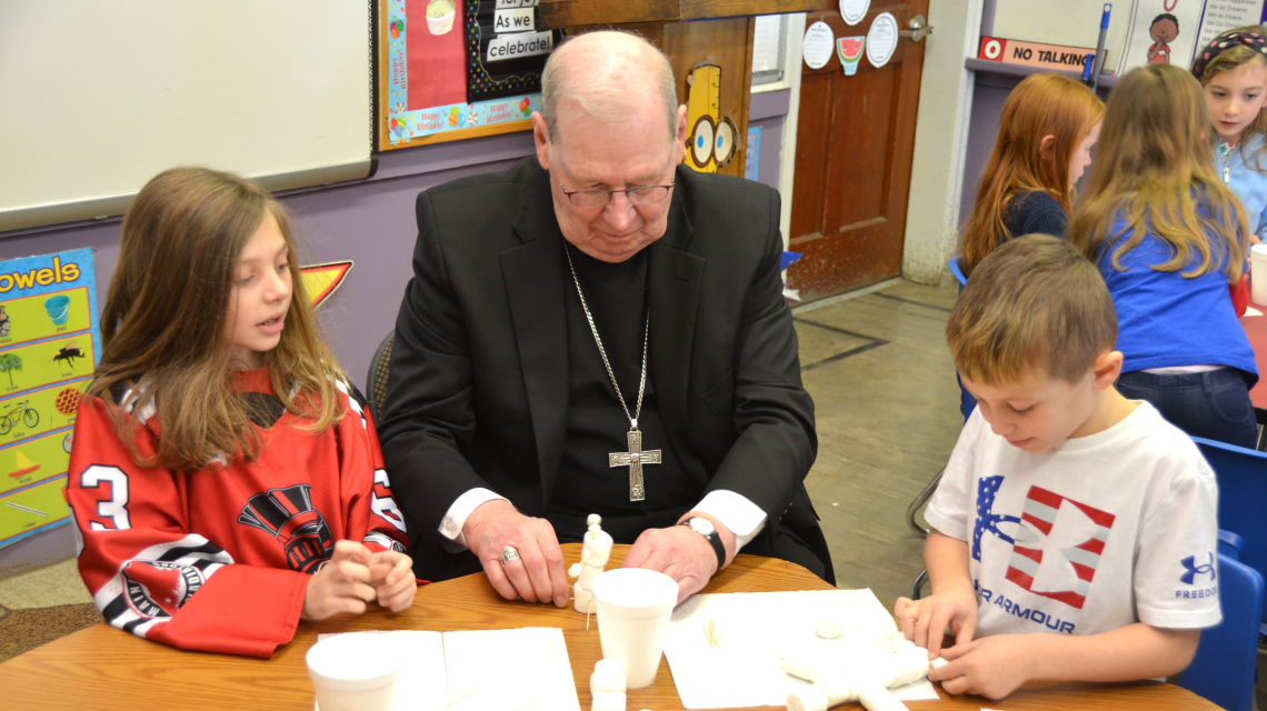 Bishop Deeley visits St. Dom's Lewiston campus during Maine Catholic Schools Week. 