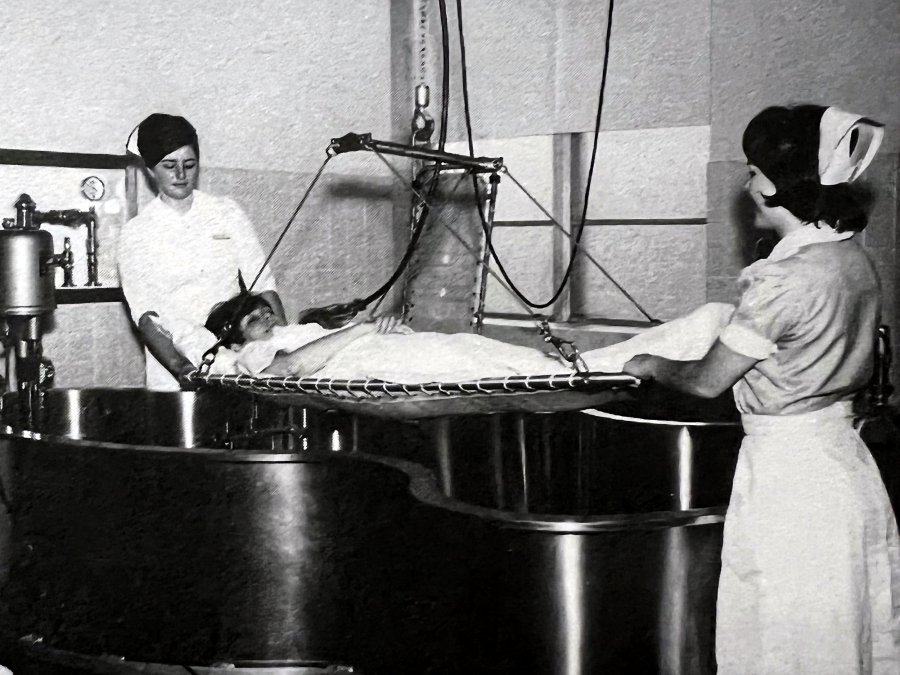 Two nurses using a Hubbard tank.