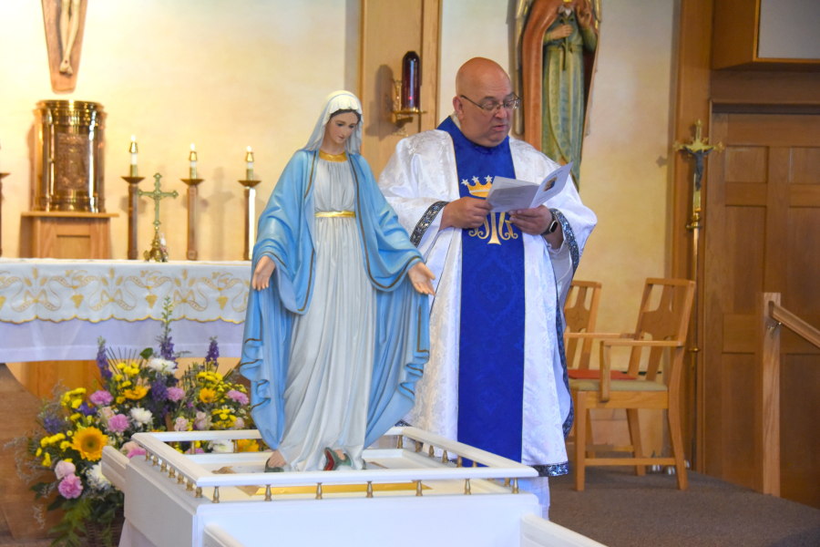 Father Paul Marquis and statue of Mary