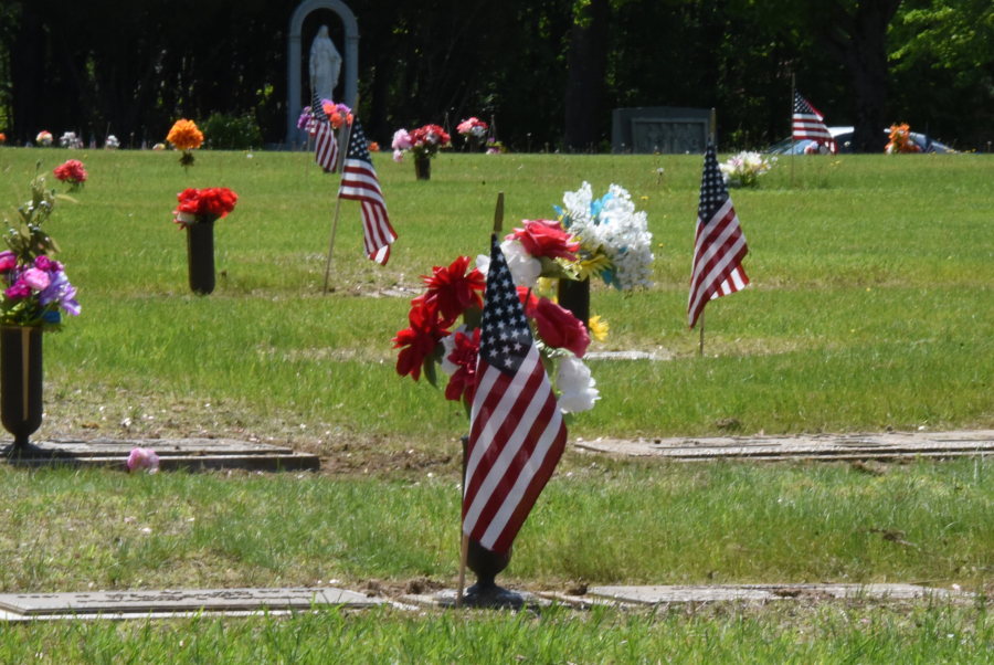 Flowers and Flag on gravestone