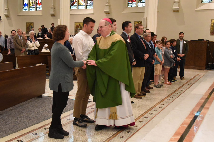 The Neophytes receive a greeting from the bishop.