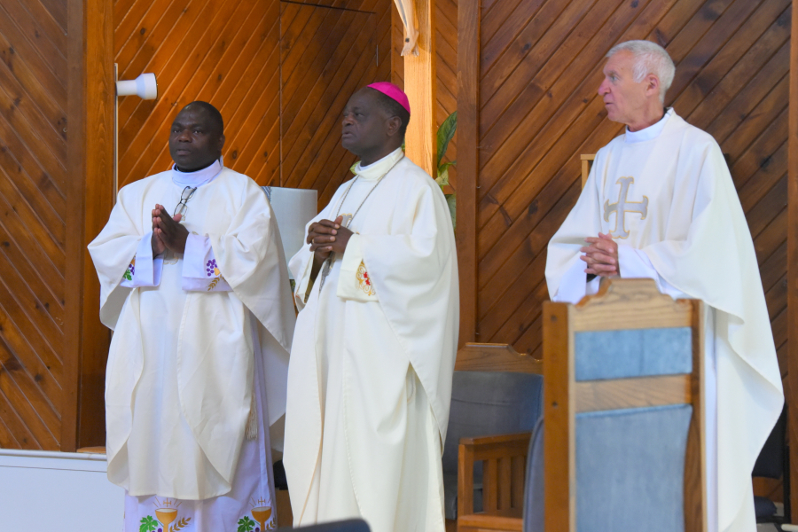 Father Anthansius Wirsiy, Bishop George Nkuo, and Father Louis Phillips