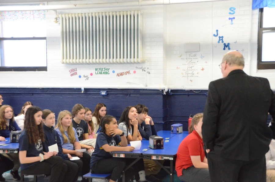 Bishop speaks to students in the cafeteria