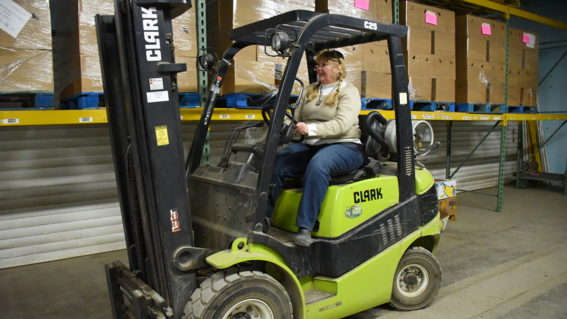 Dixie Shaw on a forklift