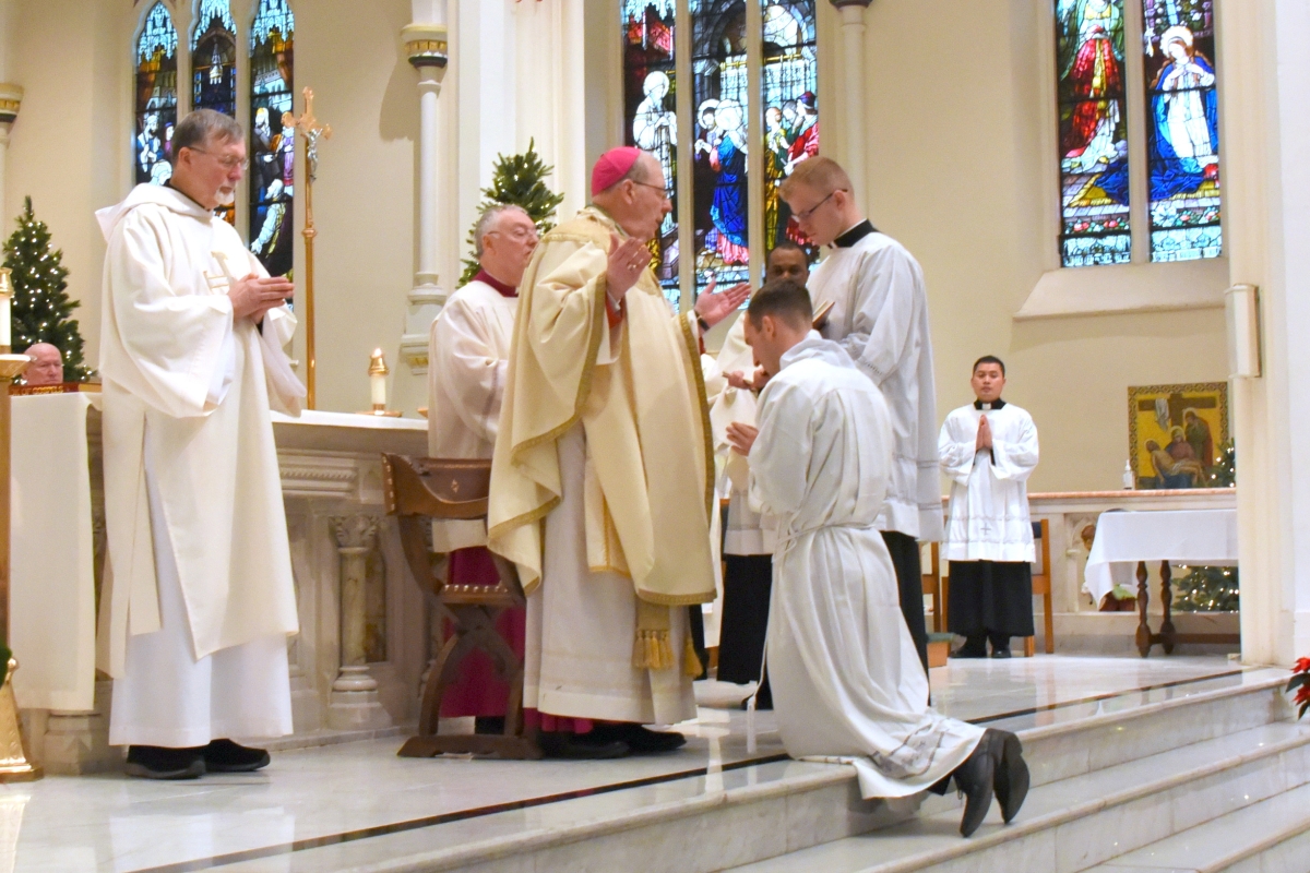 Bishop Deeley prays the Prayer of Ordination