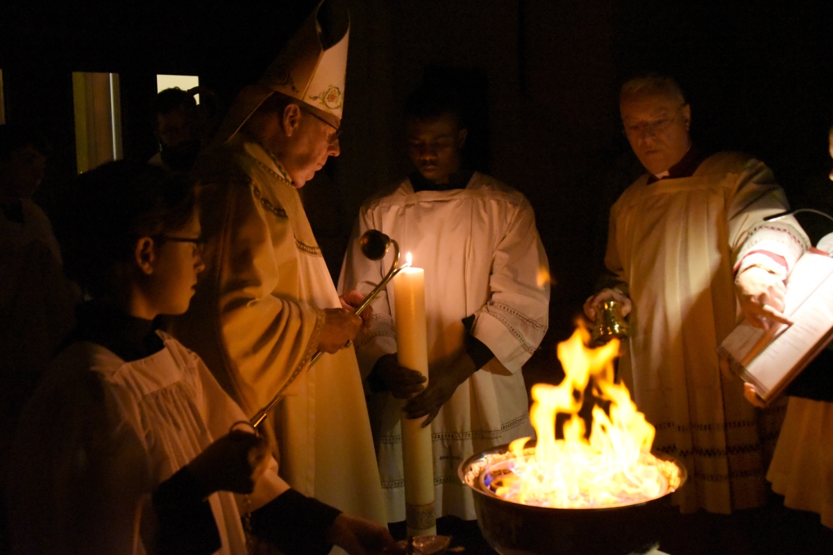 Bishop Deeley lights the Paschal Candle.